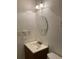 A full bathroom featuring a mirror, vanity, light fixture, and toilet at 5750 80Th N St # A106, St Petersburg, FL 33709