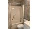 A bathroom featuring neutral wallpaper, a white tub-shower, and white sink and toilet at 5750 80Th N St # A106, St Petersburg, FL 33709