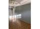 A bedroom featuring parquet floors, a window, and a closet at 5750 80Th N St # A106, St Petersburg, FL 33709