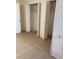 A closet featuring white bi-fold doors and showing interior shelving at 5750 80Th N St # A106, St Petersburg, FL 33709