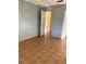 A bedroom featuring parquet floors, a doorway, and a closet at 5750 80Th N St # A106, St Petersburg, FL 33709