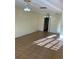 Living room featuring tile flooring and ceiling fans with access to the kitchen at 5750 80Th N St # A106, St Petersburg, FL 33709