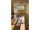 Well-lit living room with a ceiling fan and view to the exterior at 5750 80Th N St # A106, St Petersburg, FL 33709