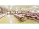 Spacious gathering room with neatly arranged tables and chairs, perfect for community events at 5750 80Th N St # A106, St Petersburg, FL 33709