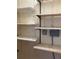 Shelving units attached to a utility closet wall at 5750 80Th N St # A106, St Petersburg, FL 33709