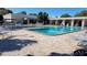 Refreshing swimming pool area with lounge chairs, tables, and landscaped surroundings for community enjoyment at 5750 80Th N St # A106, St Petersburg, FL 33709