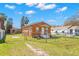 Fenced backyard featuring a storage shed and lawn at 6103 Anna Ave, Gibsonton, FL 33534