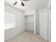 Clean bedroom featuring a ceiling fan, neutral carpet, window with blinds, and a closet at 6103 Anna Ave, Gibsonton, FL 33534