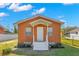 Charming single-story home with a well-manicured lawn and inviting front porch at 6103 Anna Ave, Gibsonton, FL 33534