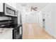 Bright living room featuring tile flooring, ceiling fans, and a fresh, neutral color palette at 6103 Anna Ave, Gibsonton, FL 33534