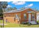 Side exterior of single story home with solar panels and a fenced yard at 6103 Anna Ave, Gibsonton, FL 33534