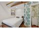 Cozy bedroom with hardwood floors, white walls, and an en-suite bathroom at 6339 S Lansdale Cir, Tampa, FL 33616