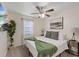 Bright bedroom with queen bed, ceiling fan, and stylish decor at 6339 S Lansdale Cir, Tampa, FL 33616