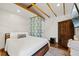 Cozy bedroom featuring wood beam ceiling and rustic decor, offering a tranquil retreat at 6339 S Lansdale Cir, Tampa, FL 33616