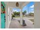 Covered entryway with stone detailing leads into the home, providing a welcoming first impression at 6339 S Lansdale Cir, Tampa, FL 33616