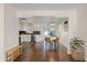 Modern kitchen with stainless appliances and stone countertops flows into the dining area with access to the backyard at 6339 S Lansdale Cir, Tampa, FL 33616