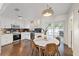 Modern eat-in kitchen featuring stainless appliances, stone countertops, and easy access to the backyard at 6339 S Lansdale Cir, Tampa, FL 33616