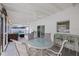 This screened patio offers an outdoor dining area for relaxation and entertaining at 6339 S Lansdale Cir, Tampa, FL 33616