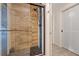 Modern bathroom showcasing a sleek, glass-encased shower with detailed tiling and modern fixtures at 6339 S Lansdale Cir, Tampa, FL 33616
