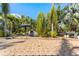 Beautiful backyard with a waterfall feature and lush landscaping, creating a private oasis at 681 Jasmine S Way, St Petersburg, FL 33705