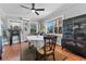 Bright dining room with large windows and a stylish china cabinet perfect for entertaining at 681 Jasmine S Way, St Petersburg, FL 33705