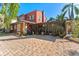 Spacious brick patio with lush landscaping and home's exterior at 681 Jasmine S Way, St Petersburg, FL 33705