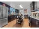 Updated kitchen featuring stainless steel refrigerator, and dark cabinets at 681 Jasmine S Way, St Petersburg, FL 33705