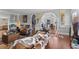 Inviting living room featuring hardwood floors, neutral paint, and decorative archways at 681 Jasmine S Way, St Petersburg, FL 33705