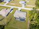 Bird's eye view of the home with screened-in pool, landscaped yard, and proximity to neighborhood amenities at 7235 Peacock Ln, Englewood, FL 34224