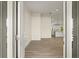 Welcoming entryway with tiled floors and a view of the open-concept kitchen at 7235 Peacock Ln, Englewood, FL 34224