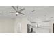 Open floor plan with eat-in kitchen, stainless appliances, and light gray wood-look flooring at 7235 Peacock Ln, Englewood, FL 34224