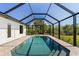 A private, screened in pool basks in natural light at 7235 Peacock Ln, Englewood, FL 34224