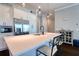 Kitchen island featuring stainless steel appliances, white countertops and cabinets at 825 Oak Bend Ln, Dunedin, FL 34698