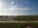 Expansive beach view lot, ready to build your coastal dream home, with blue sky and ocean backdrop at 880 Mandalay Ave # C412, Clearwater Beach, FL 33767