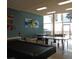 Spacious game room featuring ping pong, pool tables, and artwork for recreation at 880 Mandalay Ave # C412, Clearwater Beach, FL 33767