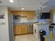 Well-equipped kitchen with modern appliances, granite countertops, and ample cabinet space at 880 Mandalay Ave # C412, Clearwater Beach, FL 33767