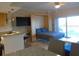 Cozy condo living area with a Murphy bed and balcony access, perfect for relaxing at 880 Mandalay Ave # C412, Clearwater Beach, FL 33767