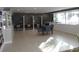 Bright lounge with reading nooks and a table for gatherings, plus bookshelves at 880 Mandalay Ave # C412, Clearwater Beach, FL 33767