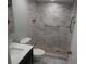 Beautiful bathroom features a vanity with a modern sink and a stylish, tiled walk-in shower at 2297 Lark E Cir # E, Palm Harbor, FL 34684