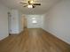 Expansive living room featuring wood-look floors and natural lighting at 2297 Lark E Cir # E, Palm Harbor, FL 34684