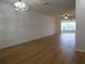 Spacious living room with wood-look floors and abundant natural light at 2297 Lark E Cir # E, Palm Harbor, FL 34684