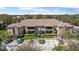Aerial view of a well-maintained apartment complex with ample parking and mature trees at 10265 Gandy N Blvd # 1203, St Petersburg, FL 33702