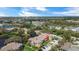 Aerial view of a community with lakefront apartments featuring scenic surroundings and beautiful landscaping with convenient parking at 10265 Gandy N Blvd # 1203, St Petersburg, FL 33702