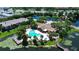 Aerial view of community showcasing the pool, spa, and lakefront amenities at 10265 Gandy N Blvd # 1203, St Petersburg, FL 33702