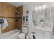 Cozy bathroom featuring a shower and bathtub combination, white vanity and storage at 10265 Gandy N Blvd # 1203, St Petersburg, FL 33702