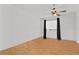 Bedroom with a ceiling fan, window, and hardwood flooring at 10265 Gandy N Blvd # 1203, St Petersburg, FL 33702