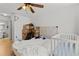 Bedroom featuring a ceiling fan, hardwood floors, and a window at 10265 Gandy N Blvd # 1203, St Petersburg, FL 33702