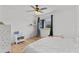 Well-lit bedroom showcasing hardwood flooring, a ceiling fan, and a window at 10265 Gandy N Blvd # 1203, St Petersburg, FL 33702