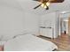 Bedroom with a ceiling fan, hardwood flooring, and a large window at 10265 Gandy N Blvd # 1203, St Petersburg, FL 33702