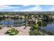 A secure gated entrance to the community, set against lush landscaping and serene water features, welcomes residents and guests at 10265 Gandy N Blvd # 1203, St Petersburg, FL 33702